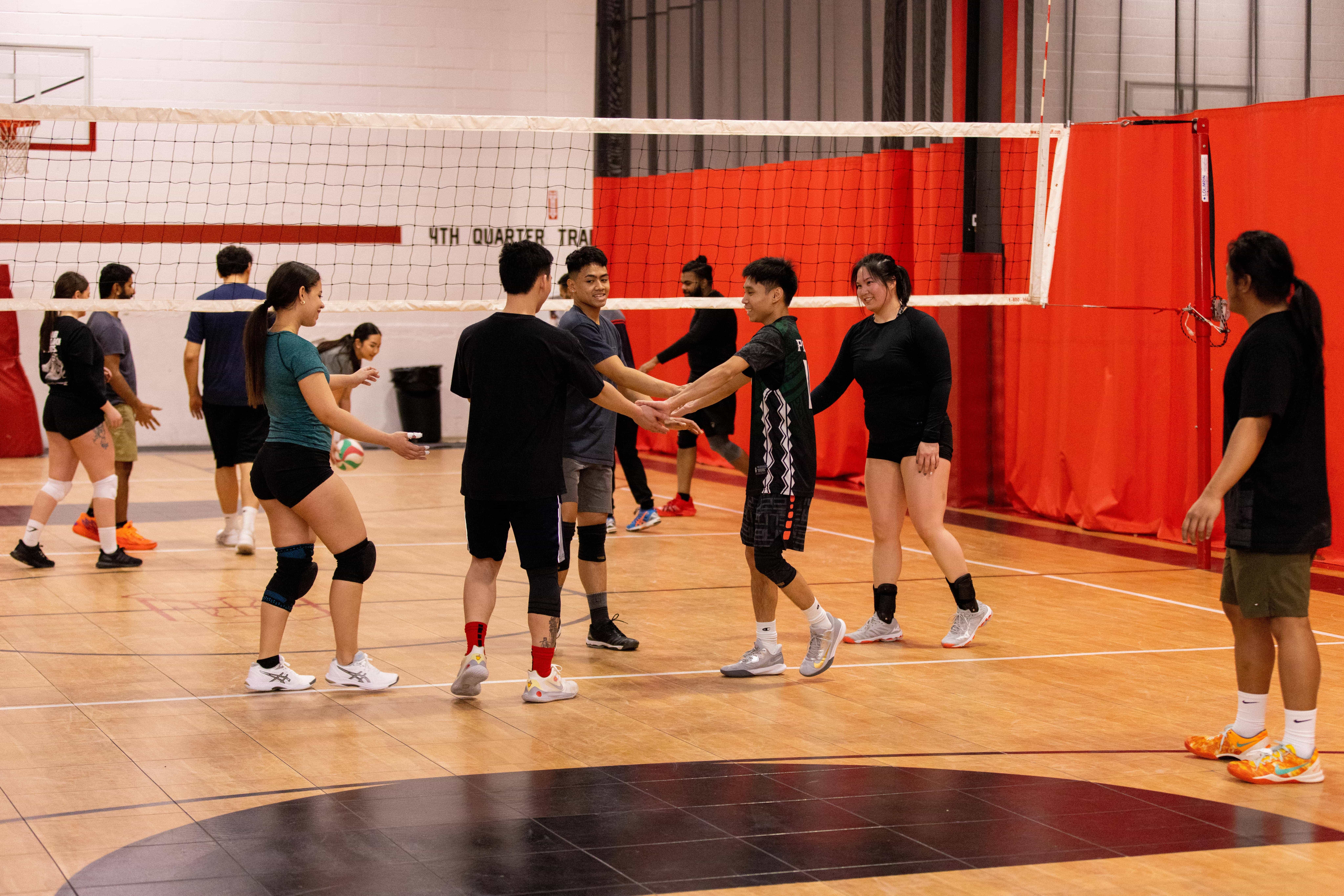 Volleyball players huddling